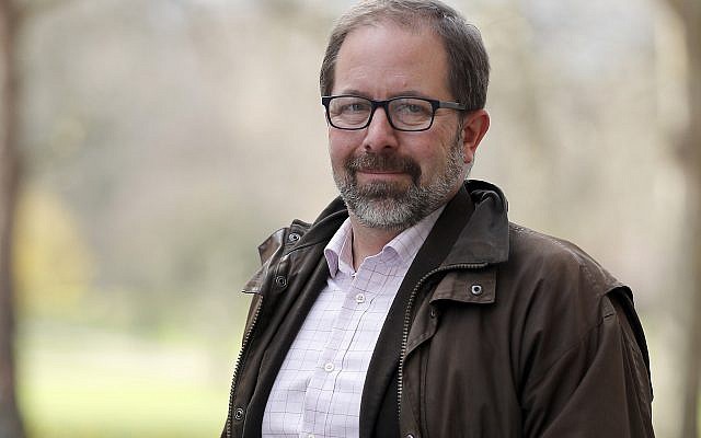 Keir Giles, a Russia specialist with Britain’s Chatham House think tank, poses for a photo in central London on Thursday, Feb. 28, 2019. (AP Photo/Frank Augstein)
