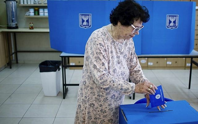 A woman votes at a polling station in the West Bank settlement of Efrat, on April 9, 2019. (AP Photo/Ariel Schalit) A woman votes at a polling station in the West Bank settlement of Efrat, on April 9, 2019. (AP Photo/Ariel Schalit)