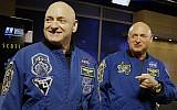 FILE - In this March 4, 2016 file photo, NASA astronaut Scott Kelly, left, and his identical twin, Mark, stand together before a news conference in Houston (AP Photo/Pat Sullivan, File)