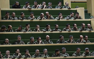 A group of Iranian army members follow the debates of parliament on a tour on the occasion of Army Day, in Tehran, Iran, April 16, 2019. (AP Photo/Vahid Salemi)