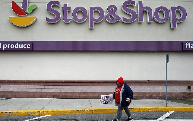 A striking workers walks outside the Stop & Shop supermarket in Revere, Mass., Thursday, April 18, 2019. (AP/Michael Dwyer) A striking workers walks outside the Stop & Shop supermarket in Revere, Mass., Thursday, April 18, 2019. (AP/Michael Dwyer)