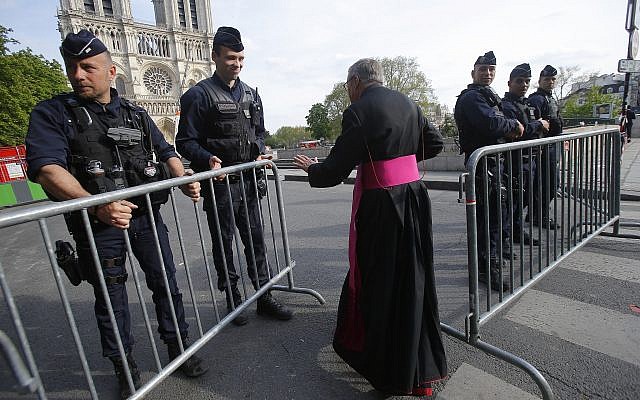 Notre Dame Cathedral rector Jean-Marc Chauvet enters the security perimeter to Notre Dame, April 18, 2019 in Paris. (AP/Michel Euler, Pool) Notre Dame Cathedral rector Jean-Marc Chauvet enters the security perimeter to Notre Dame, April 18, 2019 in Paris. (AP/Michel Euler, Pool)