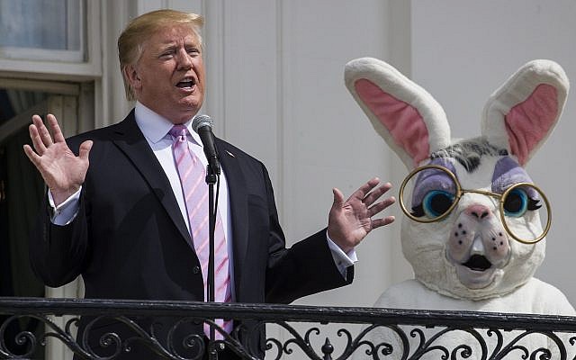 US President Donald Trump, joined by the Easter Bunny, speaks from the Truman Balcony of the White House in Washington on April 22, 2019, during the annual White House Easter Egg Roll. (AP Photo/Alex Brandon) US President Donald Trump, joined by the Easter Bunny, speaks from the Truman Balcony of the White House in Washington on April 22, 2019, during the annual White House Easter Egg Roll. (AP Photo/Alex Brandon)