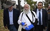 Rabbi Yisroel Goldstein, center, arrives for a news conference at the Chabad of Poway synagogue, April 28, 2019, in Poway, Calif. (AP/Denis Poroy)
