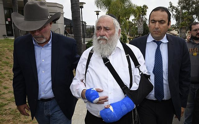 Rabbi Yisroel Goldstein, center, arrives for a news conference at the Chabad of Poway synagogue, April 28, 2019, in Poway, Calif. (AP/Denis Poroy) Rabbi Yisroel Goldstein, center, arrives for a news conference at the Chabad of Poway synagogue, April 28, 2019, in Poway, Calif. (AP/Denis Poroy)