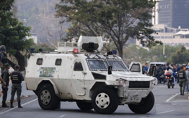 A military vehicle blocks an avenue next to La Carlota air base in Caracas, Venezuela, April 30, 2019 (AP Photo/Ariana Cubillos) A military vehicle blocks an avenue next to La Carlota air base in Caracas, Venezuela, April 30, 2019 (AP Photo/Ariana Cubillos)