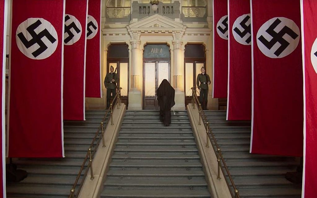 In this still from the new historical drama film 'A Rose in Winter,' Carmelite nun Edith Stein goes to Gestapo headquarters in Amsterdam to inform the authorities of her Jewish background. (Courtesy Joshua Sinclair)