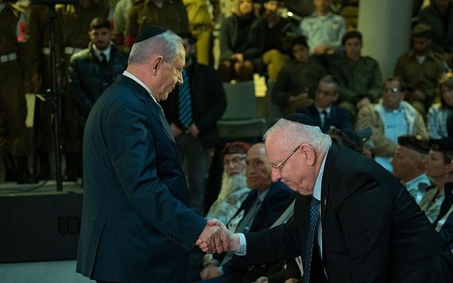 Israeli Prime Minister Benjamin Netanyhu, left, and Israeli President Reuven Rivlin attend a state ceremony for fallen Israeli soldiers whose burial place is unknown at Mount Herzl Military cemetery in Jerusalem on March 14, 2019. (Noam Revkin Fenton/Flash90) Israeli Prime Minister Benjamin Netanyhu, left, and Israeli President Reuven Rivlin attend a state ceremony for fallen Israeli soldiers whose burial place is unknown at Mount Herzl Military cemetery in Jerusalem on March 14, 2019. (Noam Revkin Fenton/Flash90)