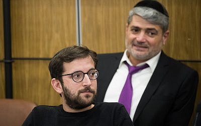 Likud campaign manager Jonathan Orich (front) and Likud campaigner Yitzhak Haddad (back) attend a Central Elections Committee meeting at the Knesset on April 3, 2019. (Yonatan Sindel/Flash90)