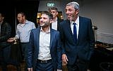 Union of Right-Wing Parties leader Rafi Peretz (R) and MK Bezalel Smotrich are greeted by supporters at the party headquarters, April 9, 2019. (Flash90)