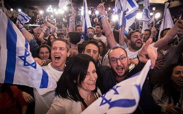 Supporters of the Blue and White party react to the first voting results in the general elections, at the party headquarters in Tel Aviv, on April 09, 2019 (Hadas Parush/Flash90) Supporters of the Blue and White party react to the first voting results in the general elections, at the party headquarters in Tel Aviv, on April 09, 2019 (Hadas Parush/Flash90)