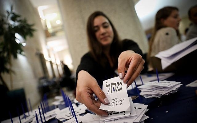 Officials count the remaining ballots from soldiers and absentees at the Knesset in Jerusalem, a day after the general elections, April 10, 2019. (Noam Revkin Fenton/Flash90) Officials count the remaining ballots from soldiers and absentees at the Knesset in Jerusalem, a day after the general elections, April 10, 2019. (Noam Revkin Fenton/Flash90)
