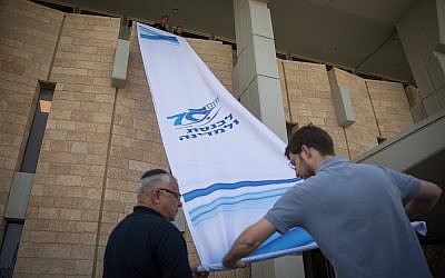 Parliament workers seen preparing the Knesset for the opening session of the 21st legislative session on April 29, 2019. (Noam Revkin Fenton/FLASH90)