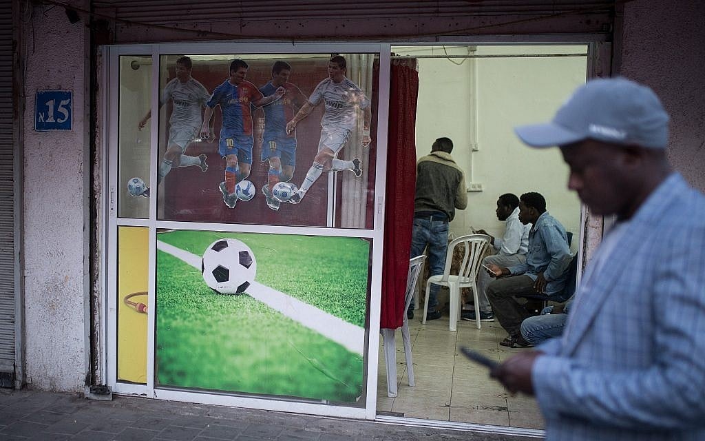 The door of Mohammed's cafe is decorated to let customers know exactly what kind of entertainment will be featured on screen.(Hadas Porush/Flash90)