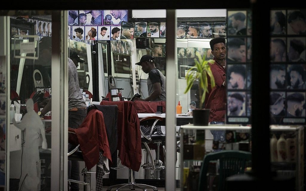A south Tel Aviv barber shop catering mostly to asylum seekers and migrant workers. (Hadas Porush/Flash90)