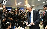 Blue and White leader Benny Gantz votes at a polling station in his hometown of Rosh Ha'ayin on April 9, 2019. (Raoul Wootliff/Times of Israel)