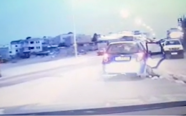 Police footage of a woman being dragged along with her parents' car in the town of Rahat on April 5, 2019. (Israel Police) Police footage of a woman being dragged along with her parents' car in the town of Rahat on April 5, 2019. (Israel Police)