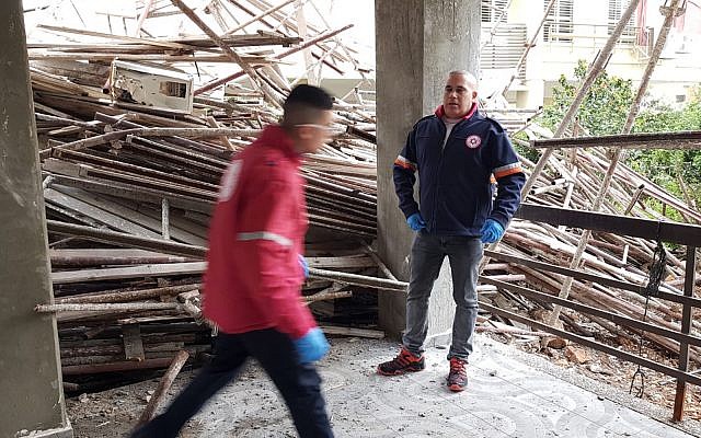 First responders at the scene of a deadly scaffolding collapse in Haifa, April 22, 2019. (Magen David Adom) First responders at the scene of a deadly scaffolding collapse in Haifa, April 22, 2019. (Magen David Adom)