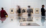 People look at work of Emil Nolde at an exhibition about the artist at the Hamburger Bahnhof museum in Berlin, Germany, April 11, 2019. (AP Photo/Markus Schreiber)
