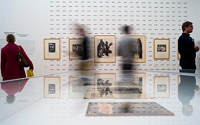 People look at work of Emil Nolde at an exhibition about the artist at the Hamburger Bahnhof museum in Berlin, Germany, April 11, 2019. (AP Photo/Markus Schreiber)