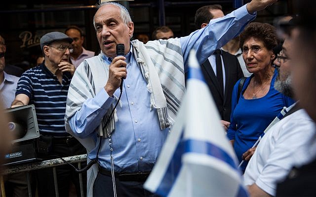 Rabbi Avi Weiss, center, the founder of Yeshivat Chovevei Torah, said the decision to deny ordination to a gay student pained him but he agreed with it. (Andrew Burton/Getty Images via JTA) Rabbi Avi Weiss, center, the founder of Yeshivat Chovevei Torah, said the decision to deny ordination to a gay student pained him but he agreed with it. (Andrew Burton/Getty Images via JTA)