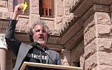 Anti-vaccination activist Del Bigtree holds a Star of David at a rally in New York. (YouTube screenshot)