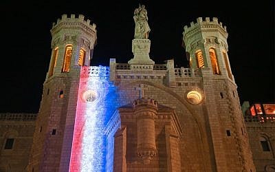 The Notre Dame center in Jerusalem is illuminated with the colors of the French flag in solidarity with Paris, April 18, 2019. (Courtesy/Arnon Bosani)