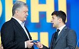 Ukrainian President Petro Poroshenko, left, and Ukrainian presidential candidate and popular comedian Volodymyr Zelensky, right, argue their debates at the Olympic stadium in Kiev, Ukraine, April 19, 2019. (AP Photo/Vadim Ghirda)