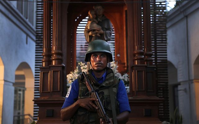 A Sri Lankan soldier stands guard at the damaged St. Anthony's Church in Colombo, Sri Lanka, April 26, 2019.  (AP Photo/Manish Swarup)
