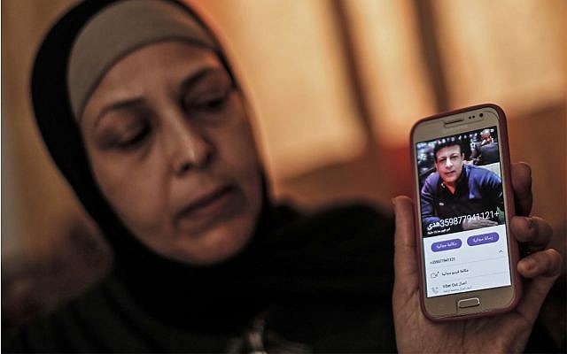 The sister of Zaki Mubarak shows his picture during an interview in their family home in Deir al-Balah, in central Gaza Strip on April 30, 2019. (Mahmud Hams/AFP) The sister of Zaki Mubarak shows his picture during an interview in their family home in Deir al-Balah, in central Gaza Strip on April 30, 2019. (Mahmud Hams/AFP)