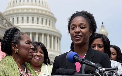 American University student government president Taylor Dumpson, right, accompanied by Rep. Sheila Jackson Lee, D-Texas, left, and others, speaks during a news conference on Capitol Hill in Washington, Thursday, May 4, 2017. (AP Photo/Susan Walsh)