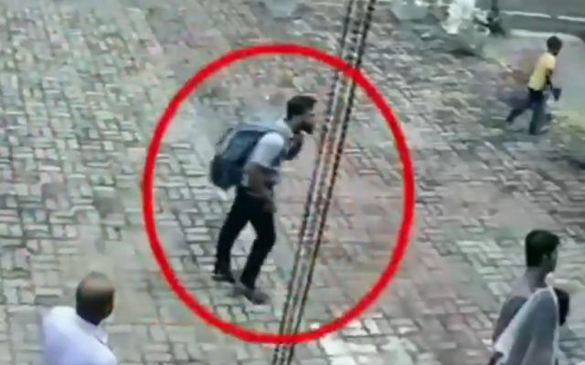 Security camera footage shows a suicide bomber, carrying a backpack, seconds before entering a church in Negombo, Sri Lanka, on April 21, 2019. (screen capture: Twitter) Security camera footage shows a suicide bomber, carrying a backpack, seconds before entering a church in Negombo, Sri Lanka, on April 21, 2019. (screen capture: Twitter)