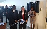 Rwandan Foreign Minister Richard Sezibera, left, and the director-general of Israel's Foreign Ministry Yuval Rotem open Israel's new embassy in Kigali, Rwanda, April 1, 2019 (courtesy MFA)