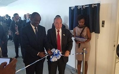 Rwandan Foreign Minister Richard Sezibera, left, and the director-general of Israel's Foreign Ministry Yuval Rotem open Israel's new embassy in Kigali, Rwanda, April 1, 2019 (courtesy MFA)
