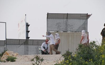 A photo released by B'Tselem on April 13, 2019, shows Israelis during clashes in the northern West Bank village of Urif. (Adel Ammar/B'Tselem)