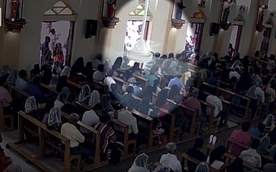 Security camera footage shows a suicide bomber, carrying a backpack, entering a church in Negombo, Sri Lanka on April 21, 2019 (screen capture: CNN)