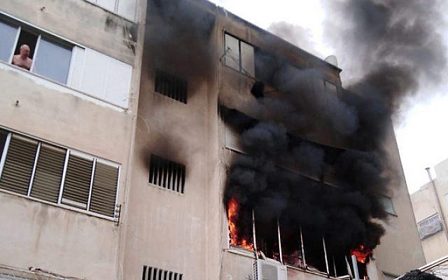 Fire burns in apartment block in Haifa, April 15 2019 (Haifa Fire Rescue Services) Fire burns in apartment block in Haifa, April 15 2019 (Haifa Fire Rescue Services)