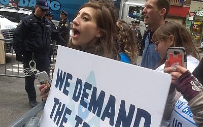 Illustrative: An activist with IfNotNow protests outside the offices of Birthright Israel in New York City on Friday, April 5, 2019. (Ben Sales)
