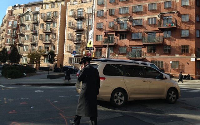 A US ultra-Orthodox man crosses the street in Williamsburg, Brooklyn, New York. (Gil Shefler via JTA) A US ultra-Orthodox man crosses the street in Williamsburg, Brooklyn, New York. (Gil Shefler via JTA)