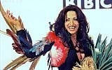Dana International, Israel's 1998 winner, in her iconic feathered dress, on display at an exhibit open for Eurovision 2019. (Courtesy)