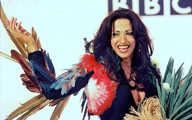 Dana International, Israel's 1998 winner, in her iconic feathered dress, on display at an exhibit open for Eurovision 2019. (Courtesy)