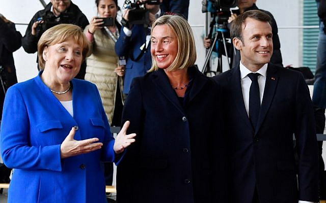 German Chancellor Angela Merkel (L) and French President Emmanuel Macron (R) greet EU's High representative for foreign affairs and security policy Federica Mogherini (C) as she arives at the chancellery in Berlin on April 29, 2019 for the West Balkans conference (John MACDOUGALL / AFP) German Chancellor Angela Merkel (L) and French President Emmanuel Macron (R) greet EU's High representative for foreign affairs and security policy Federica Mogherini (C) as she arives at the chancellery in Berlin on April 29, 2019 for the West Balkans conference (John MACDOUGALL / AFP)