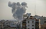 Smoke billows above buildings during an Israeli airstike on Gaza City in response to rocket fire from the coastal enclave on May 4, 2019. (Mahmud Hams / AFP)