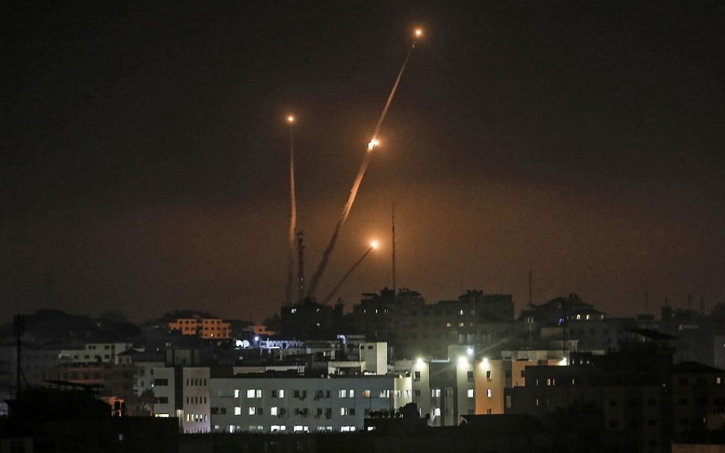 Illustrative: A picture taken in Gaza City on May 5, 2019, shows rockets being fired toward Israel. (Mahmud Hams/AFP)
