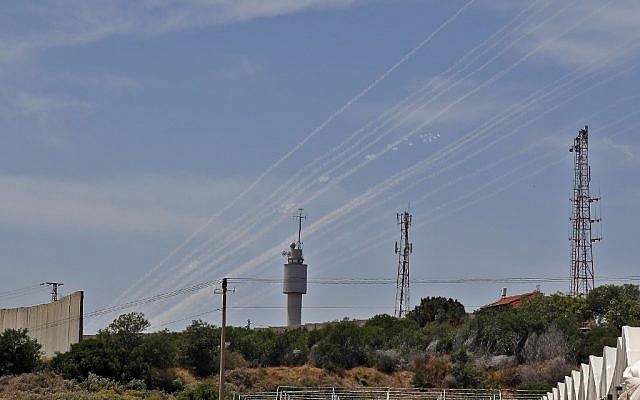 The smoke trails of rockets fired at Israel from the Gaza Strip, seen from the southern Israeli village of Netiv Haasara on May 5, 2019. (Jack Guez/AFP) The smoke trails of rockets fired at Israel from the Gaza Strip, seen from the southern Israeli village of Netiv Haasara on May 5, 2019. (Jack Guez/AFP)