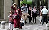 Iranians walk along Valiasr Street in northern Tehran on May 8, 2019. (Atta Kenare/AFP)