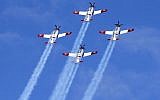 Israeli Efroni T-6 Texan II planes perform during an air show, over the beach in the Mediterranean coastal city of Tel Aviv, on May 9, 2019 as Israel marks Independence Day, 71 years after the modern Jewish state was established. (JACK GUEZ / AFP)