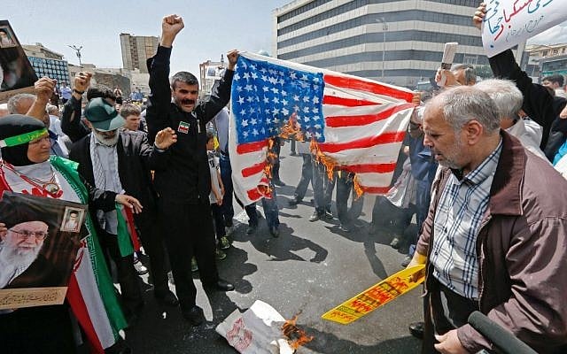 Iranian demonstrators burn a makeshift US flag during a rally in the capital Tehran, on May 10 2019. (Stringer/AFP) Iranian demonstrators burn a makeshift US flag during a rally in the capital Tehran, on May 10 2019. (Stringer/AFP)