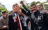 Iranian demonstrators carry a portrait of Iran's Supreme Leader Ayatollah Ali Khamenei and an effigy of US President Donald Trump, during a rally in the capital Tehran, on May 10, 2019. (Stringer/AFP)