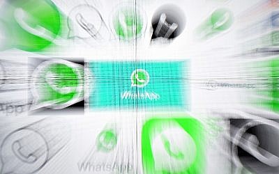 A photo from March 22, 2018, shows WhatsApp logos on a screen in Kuala Lumpur, Malaysia. (Manan Vatsyayana/AFP)